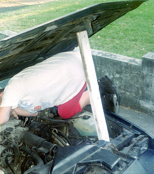 95-08-00, 25, Michael Working on his Car