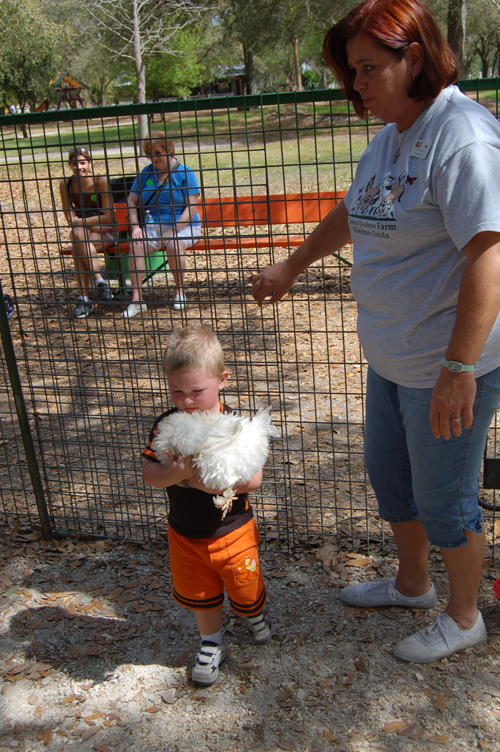 06-03-02, 61, Connor holding Chicken, Green Meadows, Fl